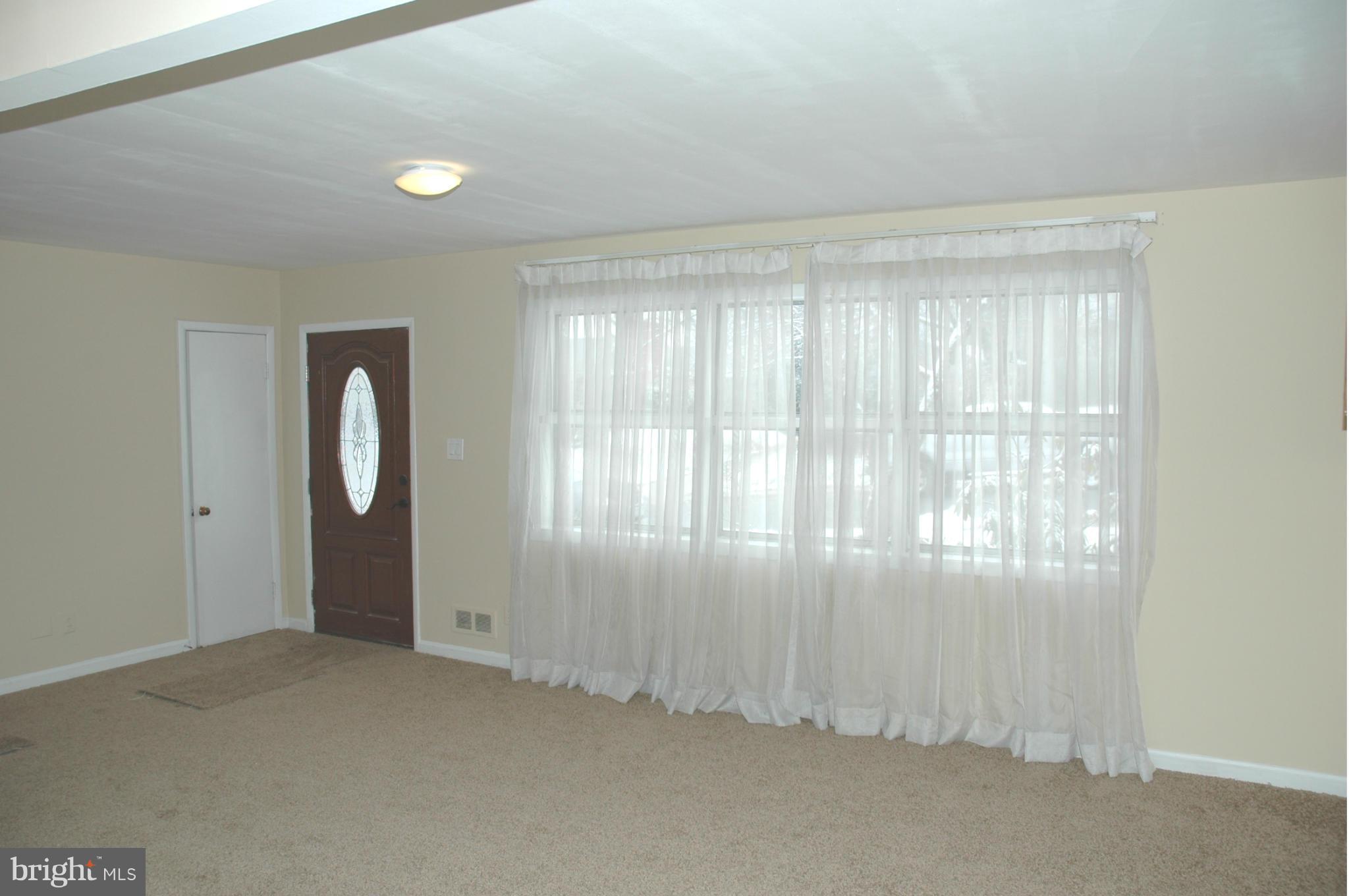 103 Mountain Road Linthicum, MD 21090 - Photo 4 of 17 an empty room with windows