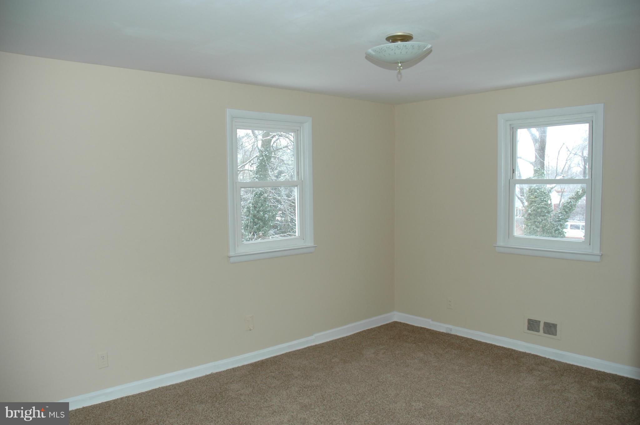 103 Mountain Road Linthicum, MD 21090 - Photo 8 of 17 an empty room with windows