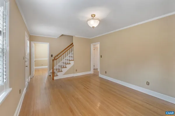 a view of an entryway with wooden floor