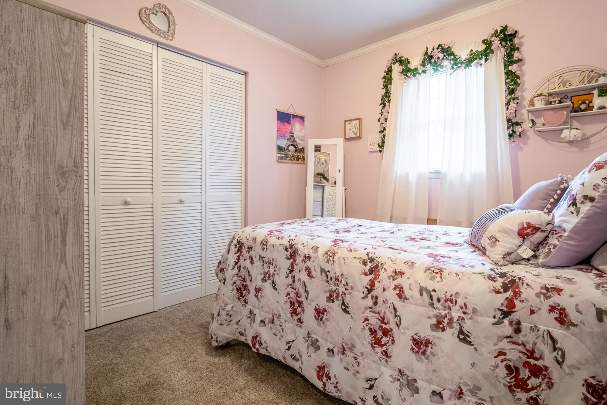 1398 Manor Road Windsor, PA 17366 - Photo 19 of 39 Charming pastel bedroom with floral accents.