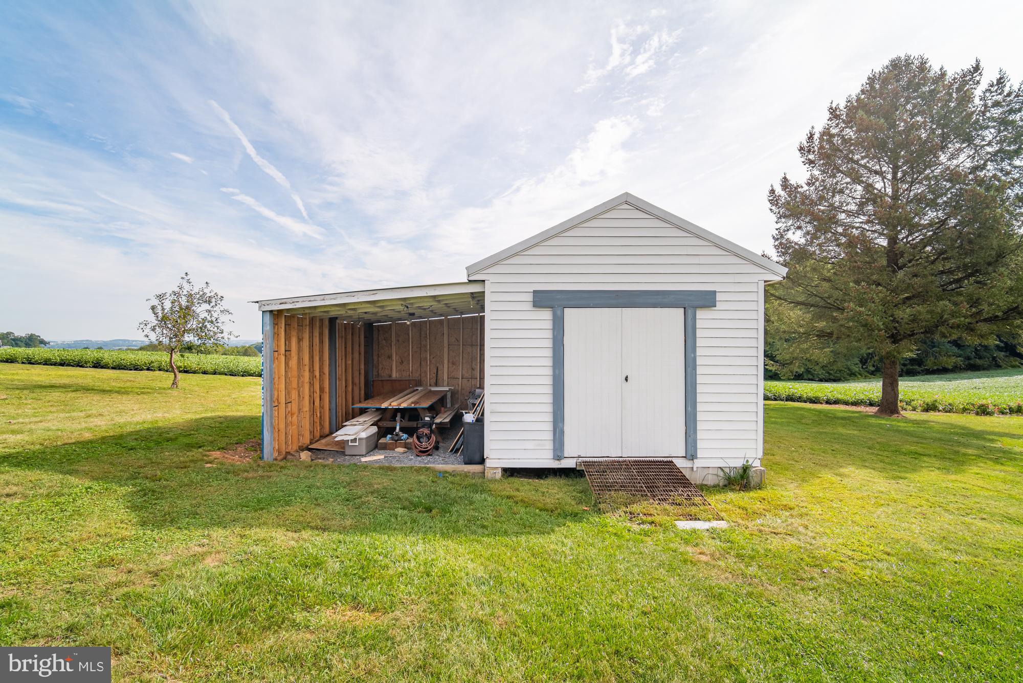 1398 Manor Road Windsor, PA 17366 - Photo 33 of 39 Charming shed amidst lush green fields.