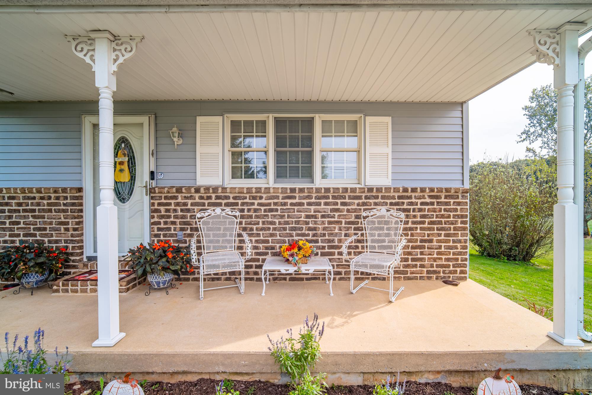 1398 Manor Road Windsor, PA 17366 - Photo 36 of 39 Charming porch with inviting floral accents.