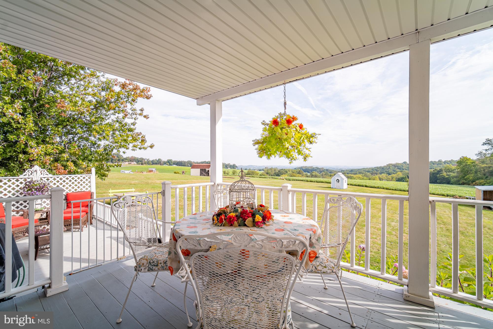 1398 Manor Road Windsor, PA 17366 - Photo 4 of 39 Charming porch with scenic countryside views.