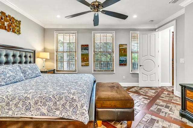 a bathroom with a sink a toilet a mirror and shower