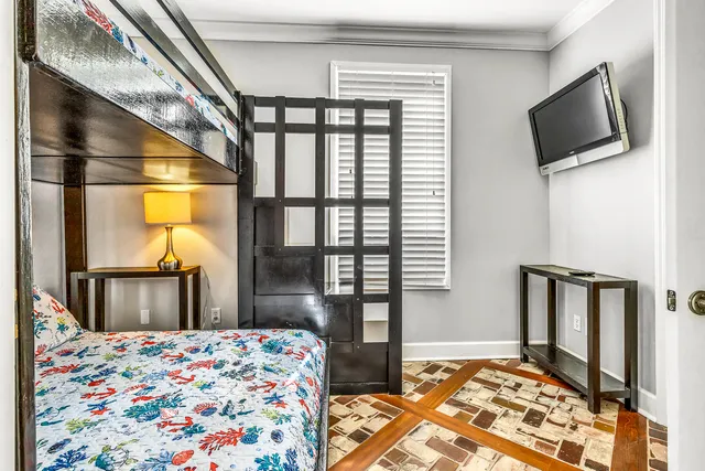 a living room with fireplace furniture and a wooden floor