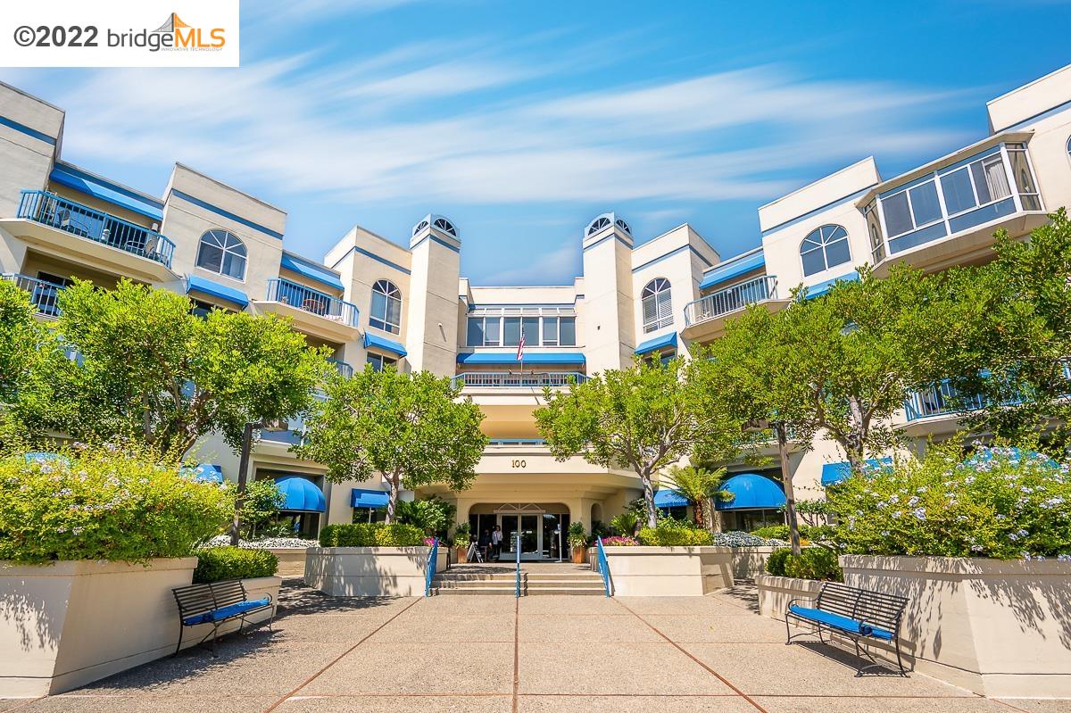 a view of multiple houses with a street