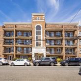 a front view of a building with parking space