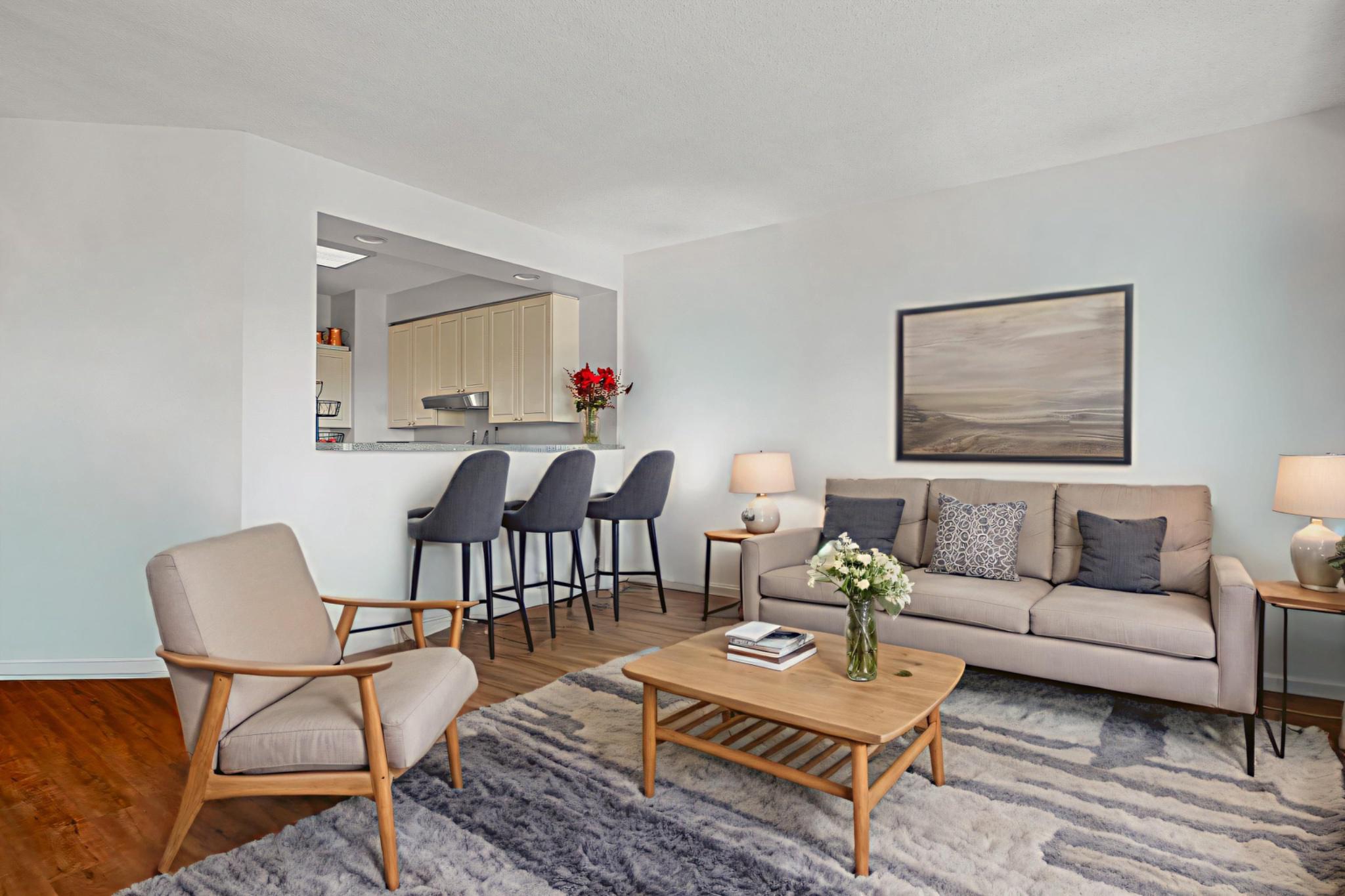 3005 South Leisure World Boulevard, Unit 702 Silver Spring, MD 20906 - Photo 2 of 43 a living room with furniture a rug and a dining table