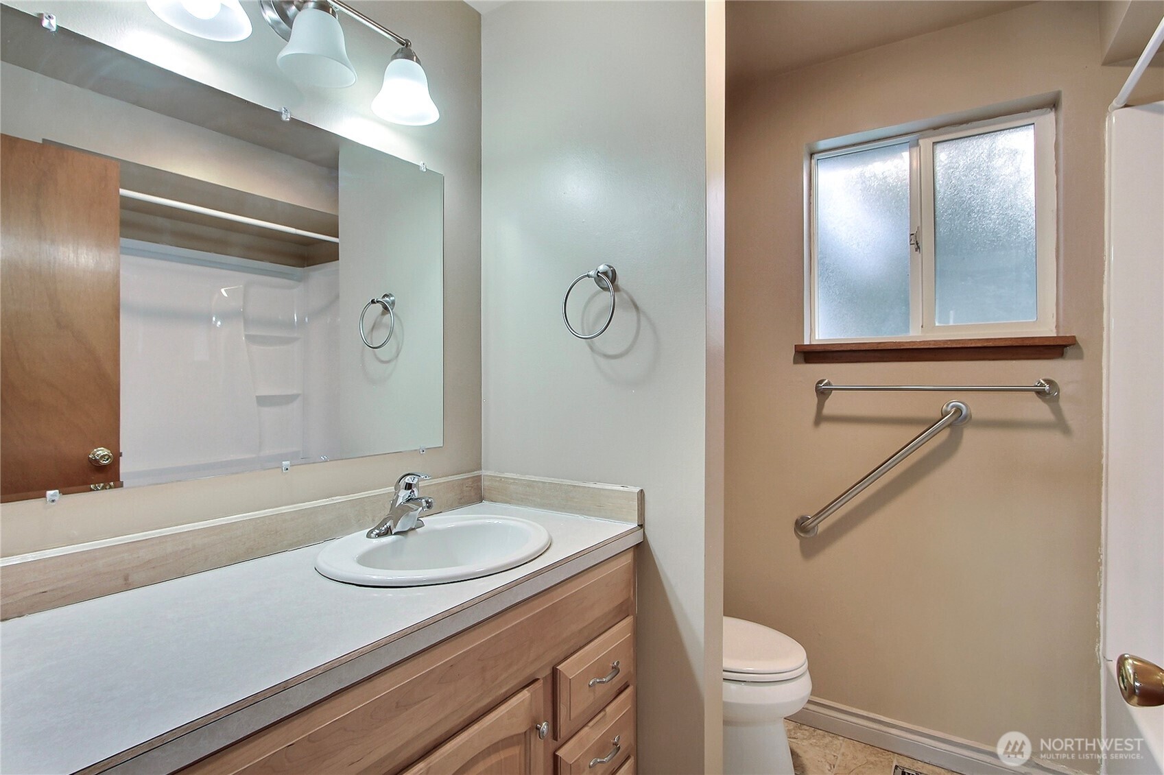 1415 South 303rd Street Federal Way, WA 98003 - Photo 11 of 15 a bathroom with a granite countertop sink a toilet and a mirror