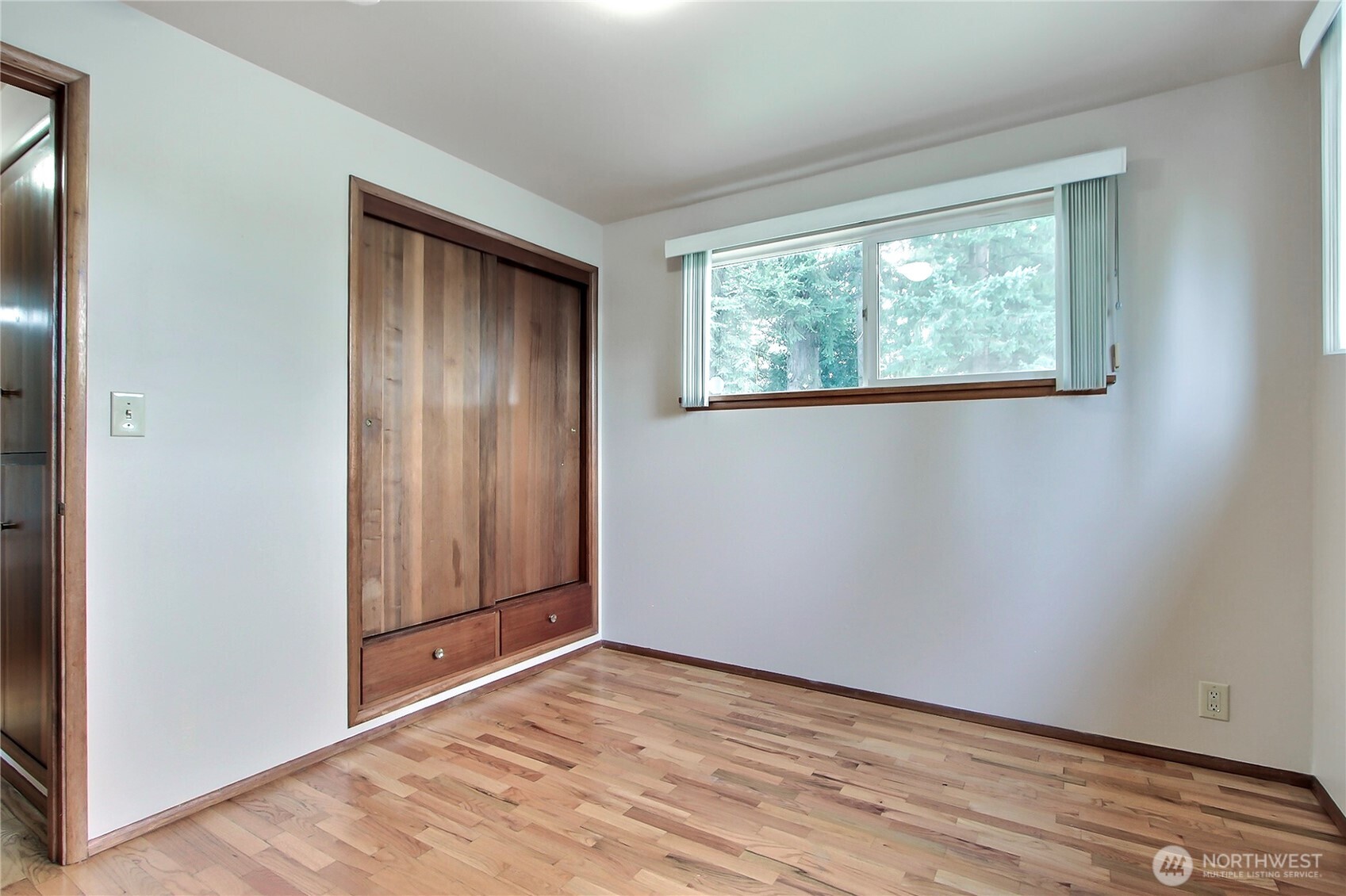 1415 South 303rd Street Federal Way, WA 98003 - Photo 12 of 15 an empty room with wooden floor and windows