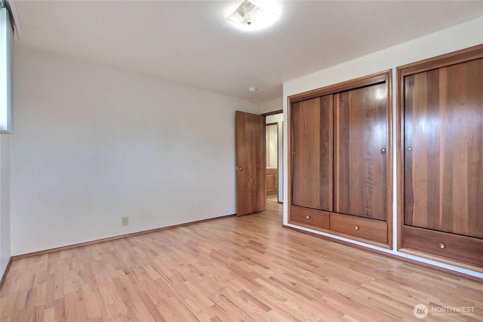 1415 South 303rd Street Federal Way, WA 98003 - Photo 13 of 15 a view of an empty room with wooden floor