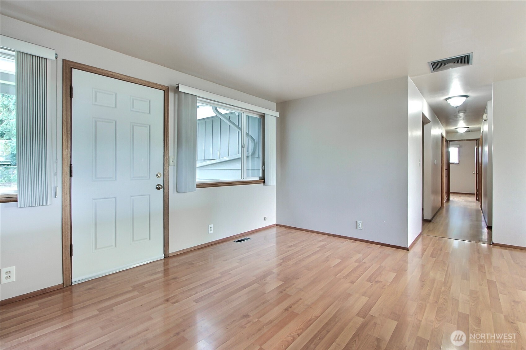 1415 South 303rd Street Federal Way, WA 98003 - Photo 3 of 15 a view of an empty room with wooden floor and a window