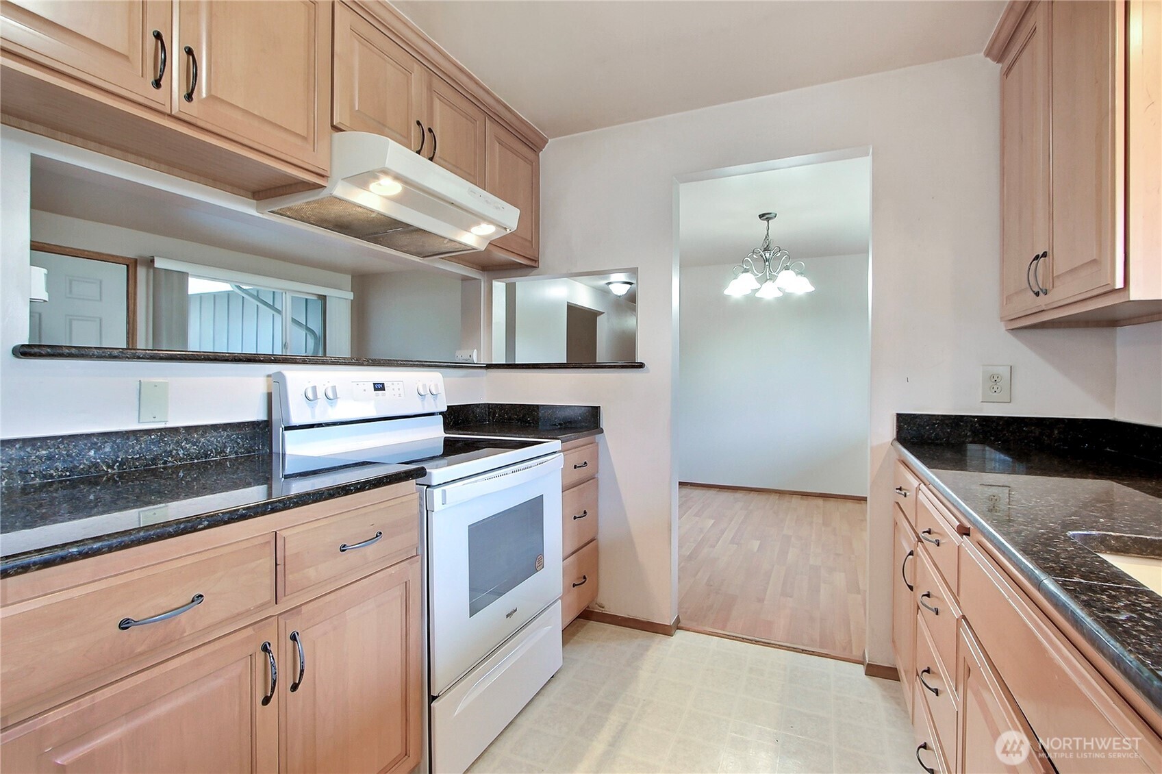 1415 South 303rd Street Federal Way, WA 98003 - Photo 7 of 15 a kitchen with granite countertop cabinets stainless steel appliances and a counter space