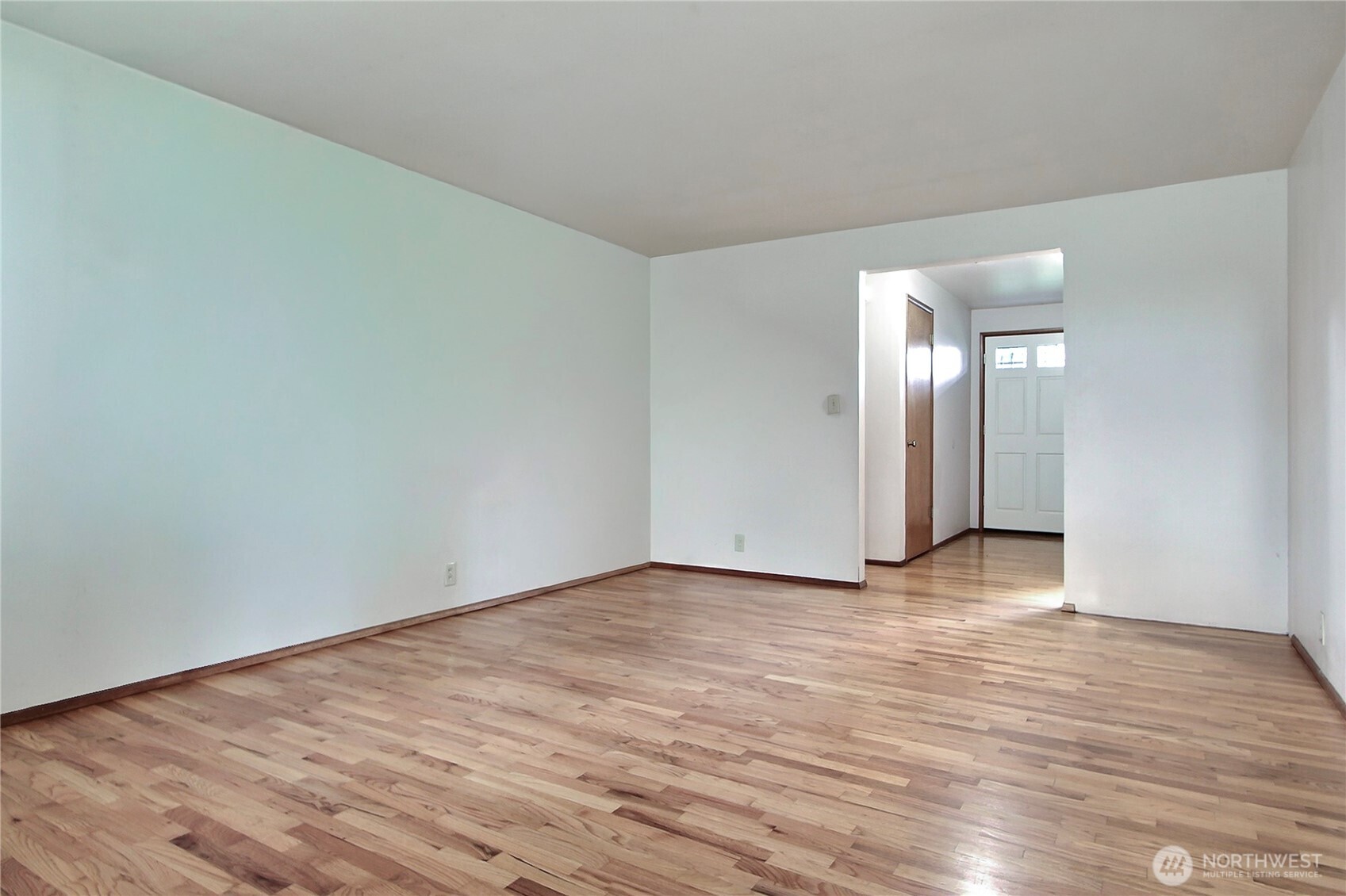 1415 South 303rd Street Federal Way, WA 98003 - Photo 9 of 15 a view of an empty room and wooden floor