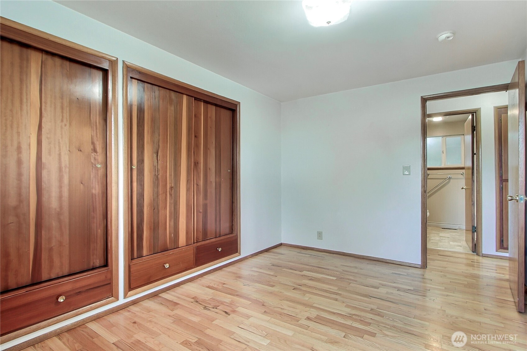 1415 South 303rd Street Federal Way, WA 98003 - Photo 10 of 15 a view of an empty room with wooden floor