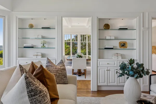 a large white kitchen with sink stove and refrigerator