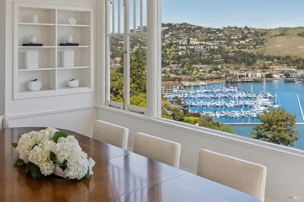 a view of a dining room with furniture window and outside view
