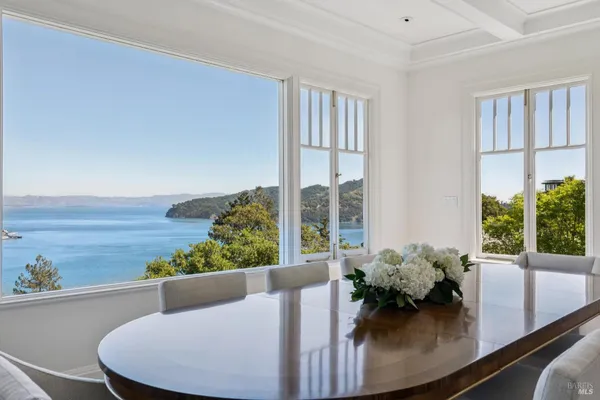 a view of an entryway with wooden floor and a front door
