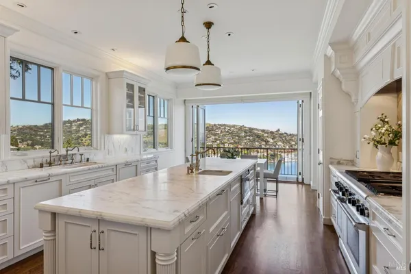 a view of a hallway with wooden floor and entryway
