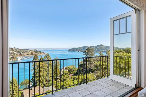 a spacious bedroom with a bed and a fireplace