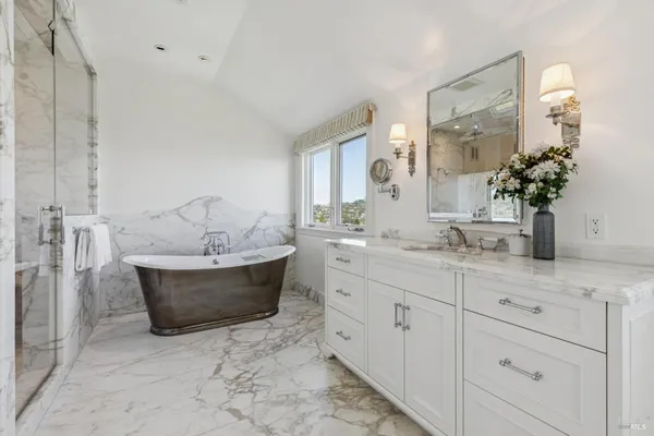 an aerial view of a house with a yard and garden