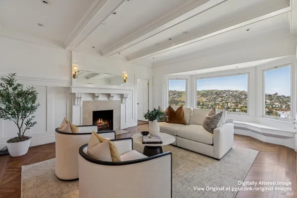 a dining room with furniture and a floor to ceiling window