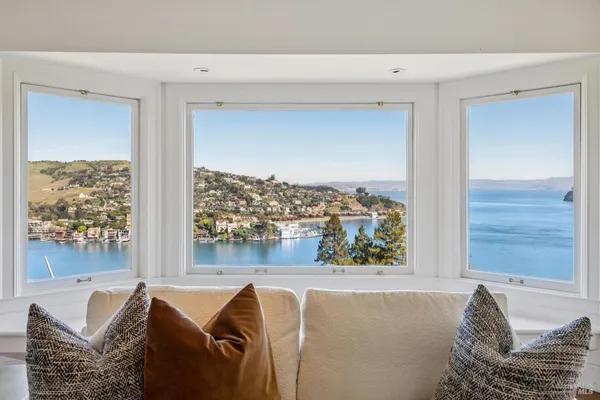 a living room with fireplace furniture and a chandelier