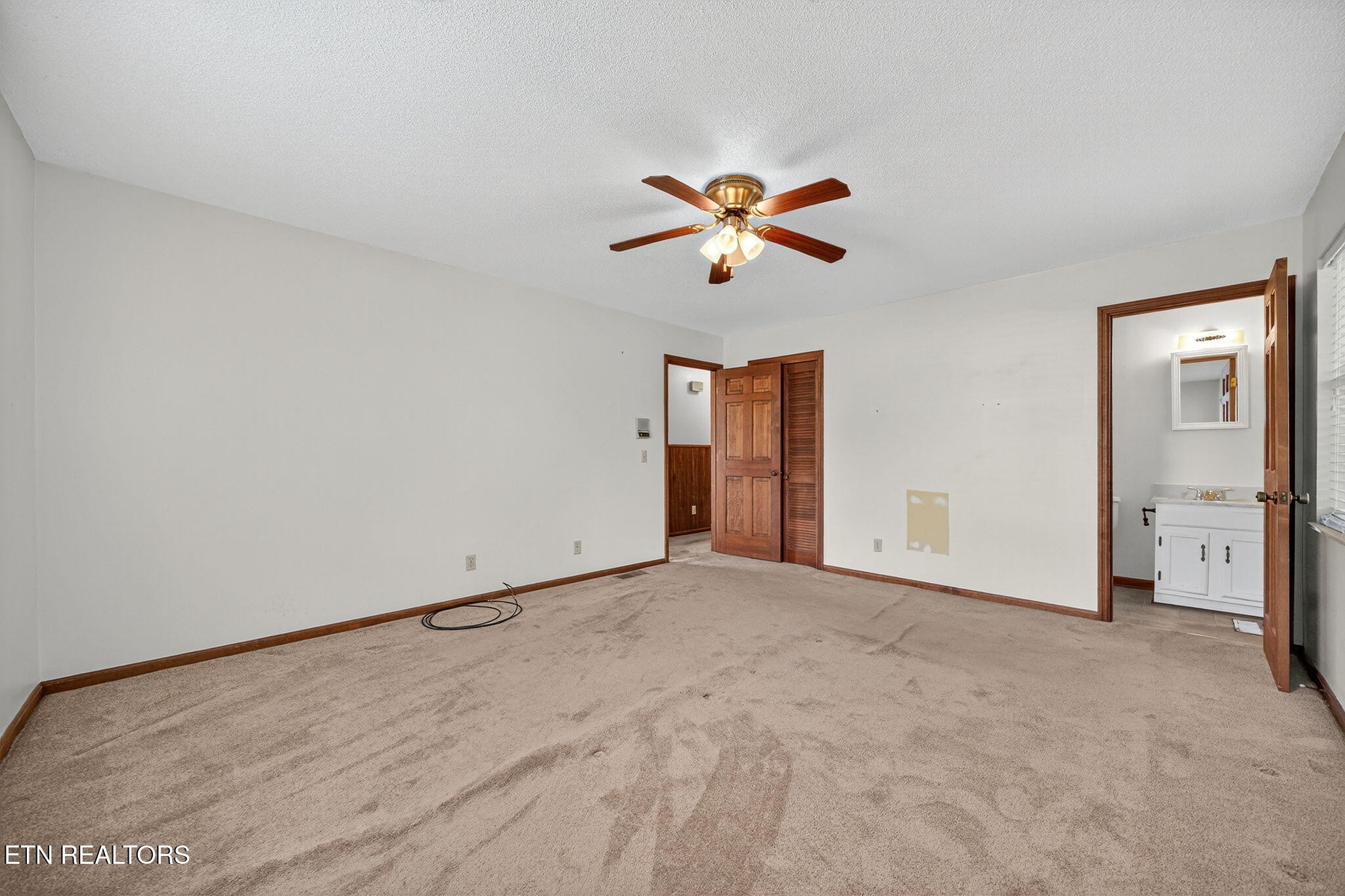 330 Hutsell Drive Decatur, TN 37322 - Photo 13 of 35 an empty room with closet and a ceiling fan