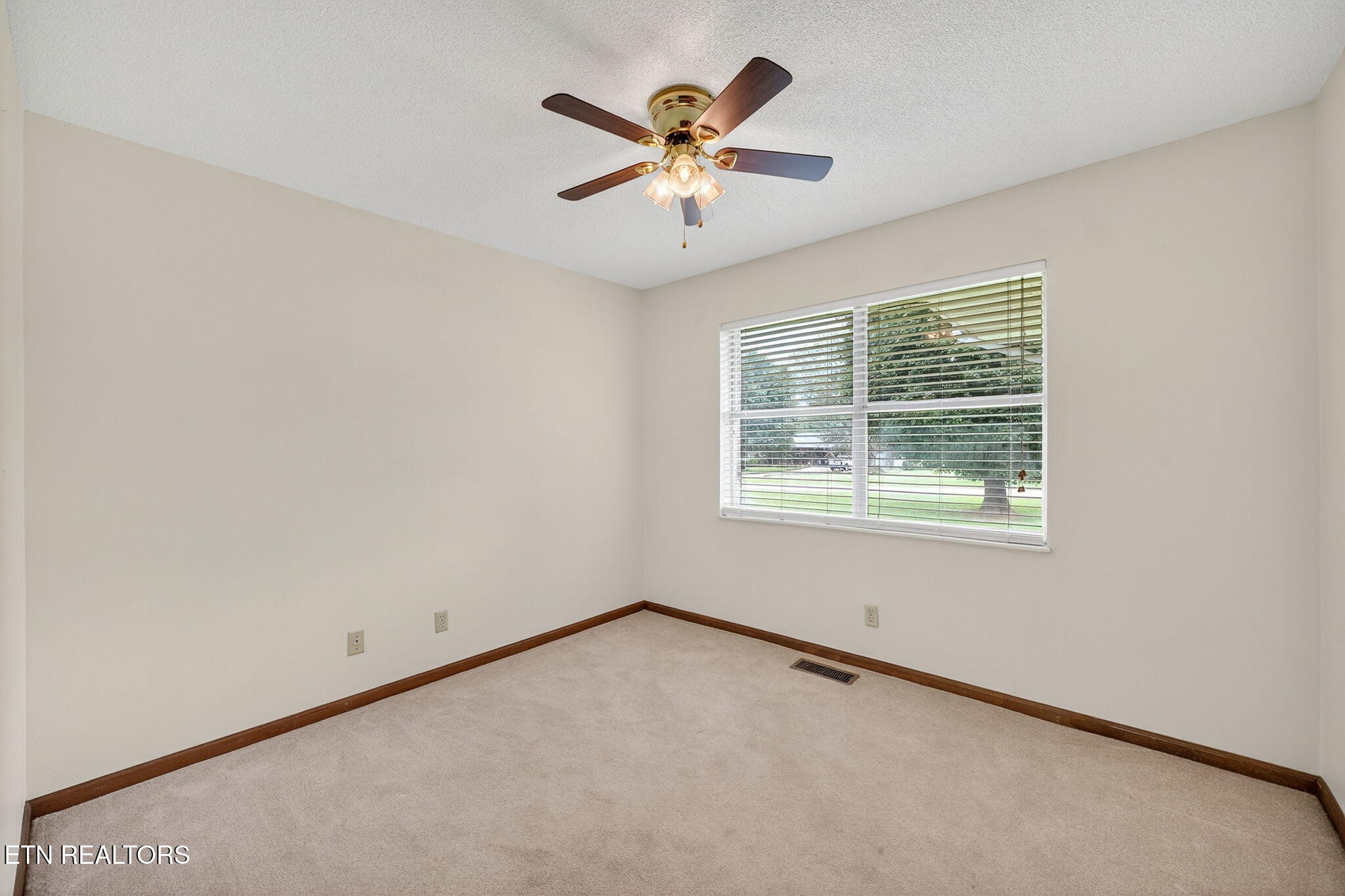 330 Hutsell Drive Decatur, TN 37322 - Photo 17 of 35 an empty room with window and ceiling fan