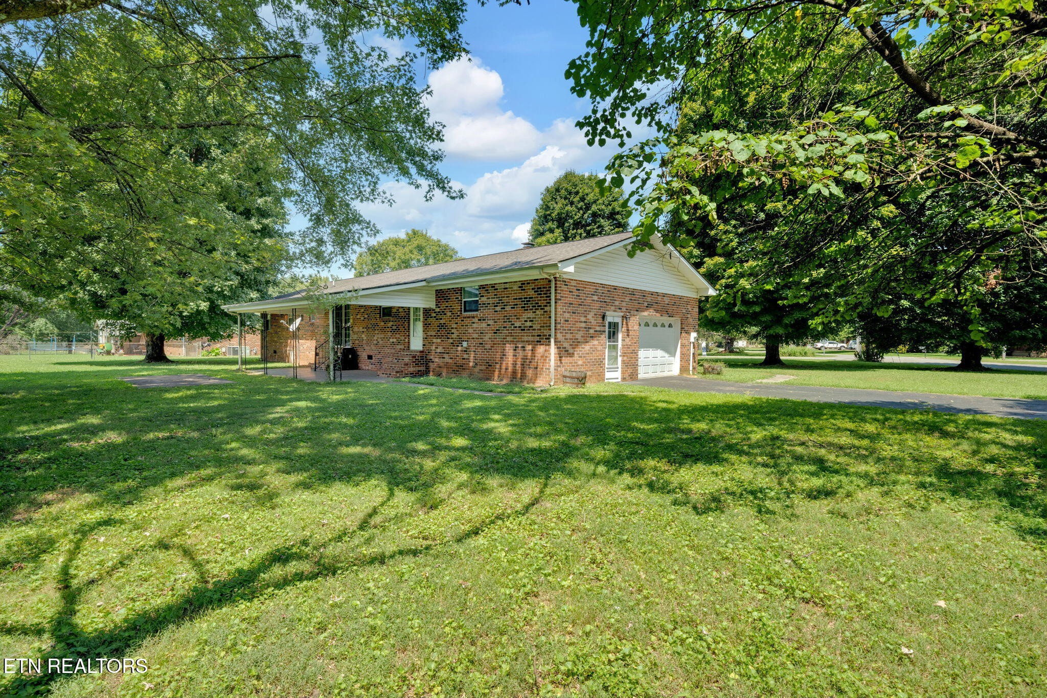 330 Hutsell Drive Decatur, TN 37322 - Photo 28 of 35 a front view of a house with a yard