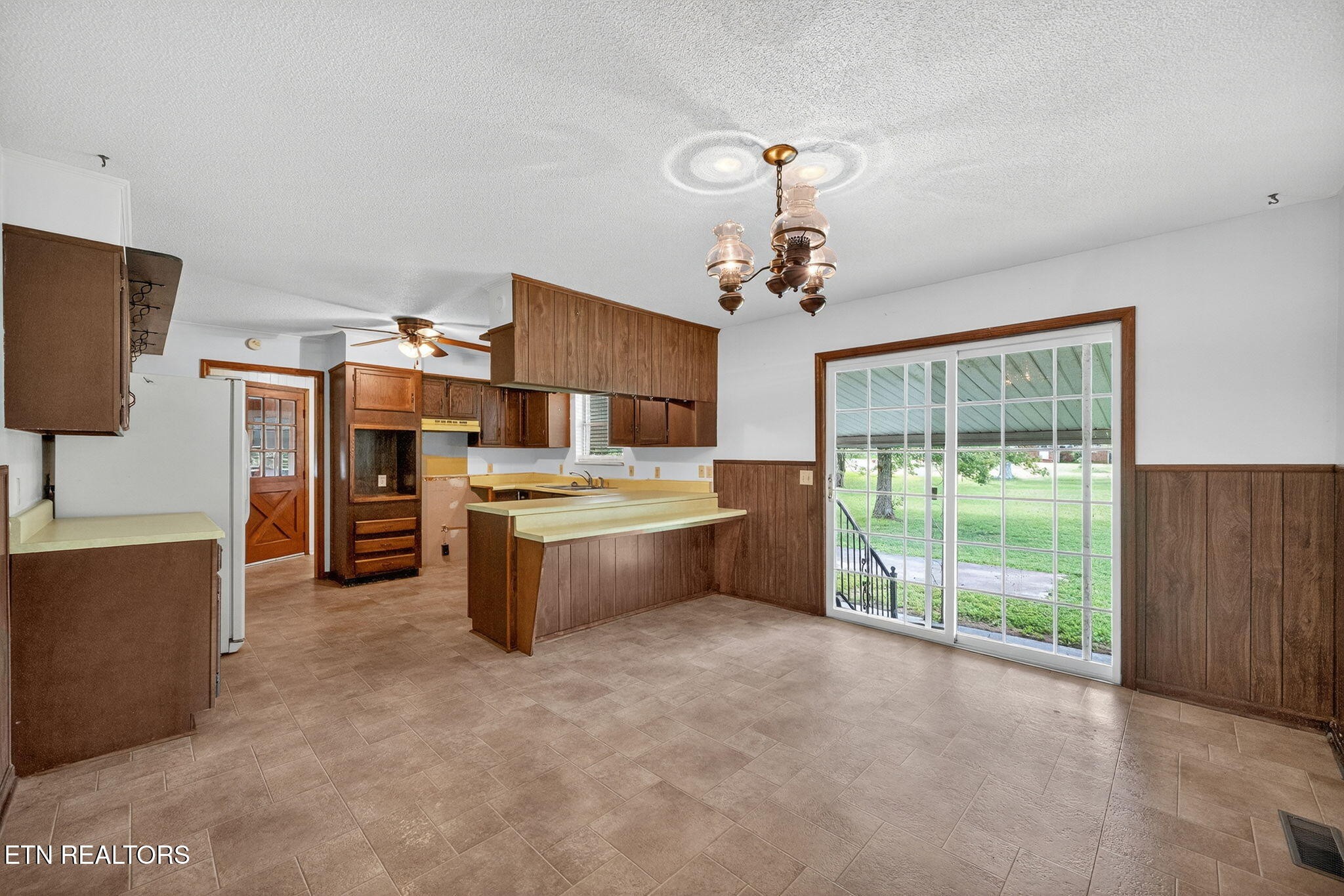 330 Hutsell Drive Decatur, TN 37322 - Photo 8 of 35 a large kitchen with a large window and stainless steel appliances