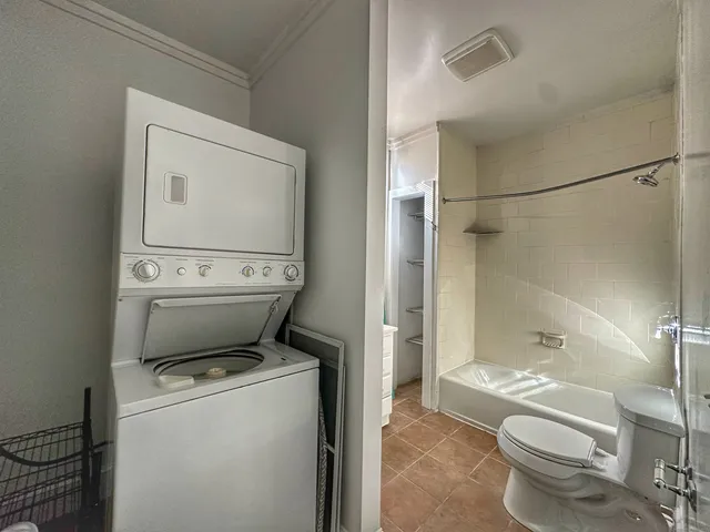 a bathroom with a toilet sink and shower