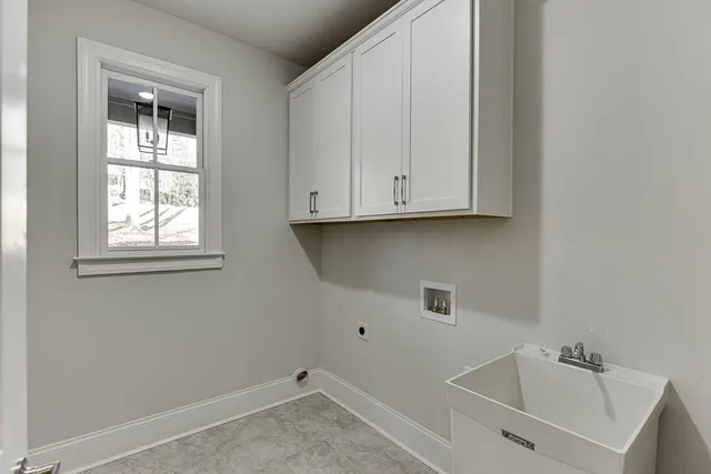 a bathroom with a sink and cabinets