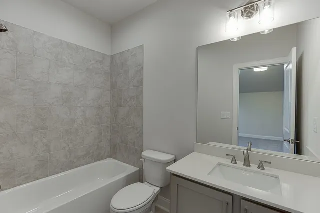 a bathroom with a sink toilet and bathtub