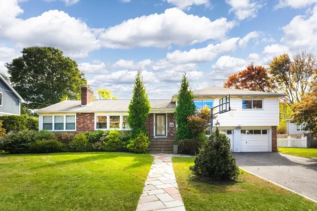 a front view of a house with garden