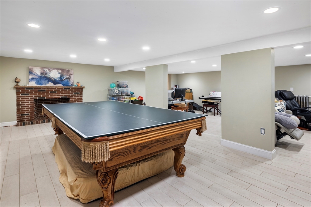 45 Brandeis Road Newton, MA 02459 - Photo 11 of 12 a room with wooden floor pool table and a couch