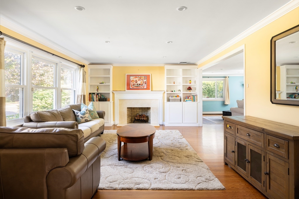 45 Brandeis Road Newton, MA 02459 - Photo 2 of 12 a living room with furniture large window and a fireplace