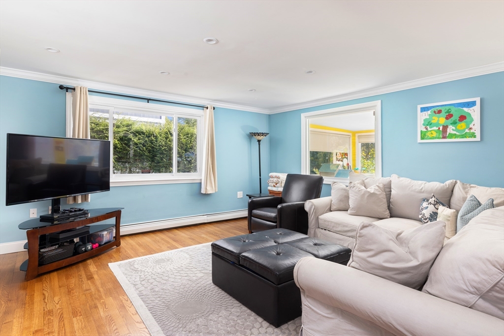 45 Brandeis Road Newton, MA 02459 - Photo 6 of 12 a living room with furniture and a flat screen tv