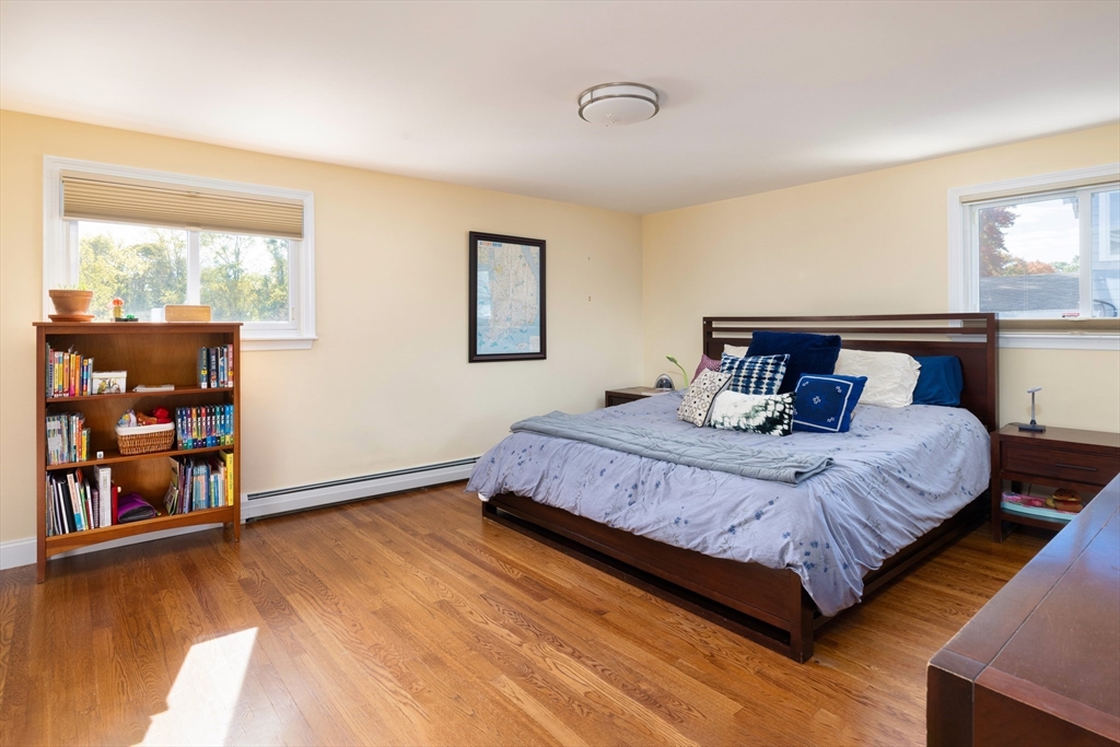 45 Brandeis Road Newton, MA 02459 - Photo 8 of 12 a bedroom with a bed and window