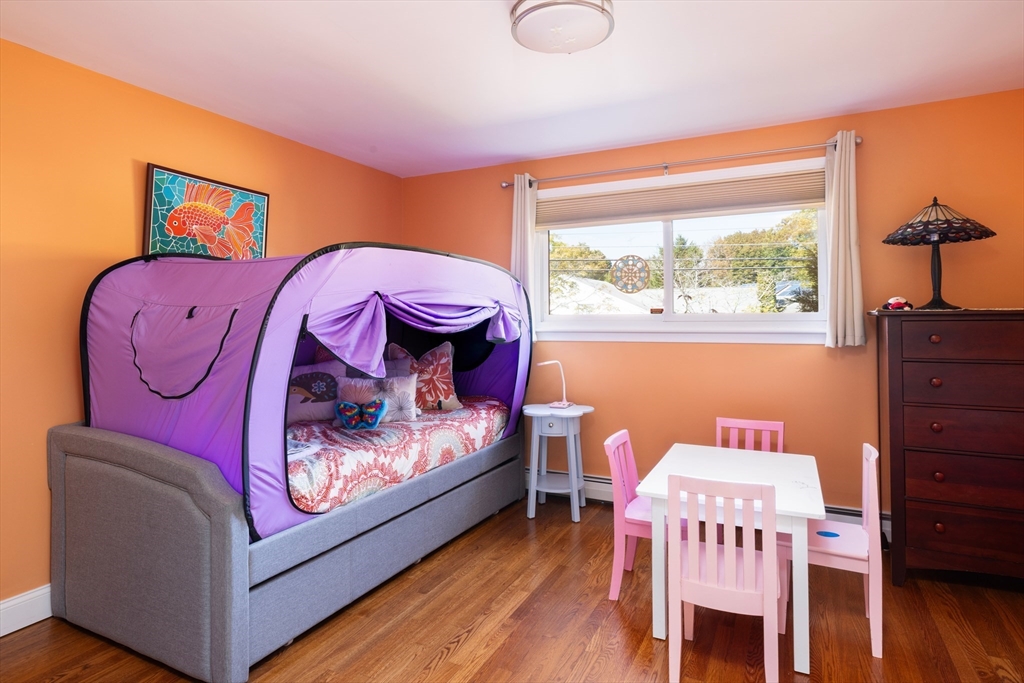 45 Brandeis Road Newton, MA 02459 - Photo 9 of 12 a living room with furniture and a large window