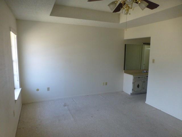4612 Ranch View Road Fort Worth, TX 76109 - Photo 15 of 17 an empty room with a ceiling fan and window