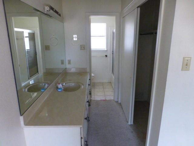 4612 Ranch View Road Fort Worth, TX 76109 - Photo 16 of 17 view of a bathroom with a sink and mirror
