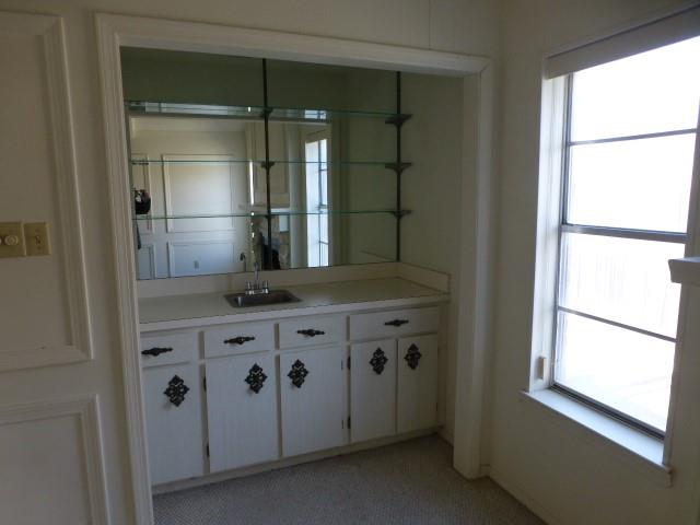 4612 Ranch View Road Fort Worth, TX 76109 - Photo 8 of 17 a kitchen with windows and refrigerator