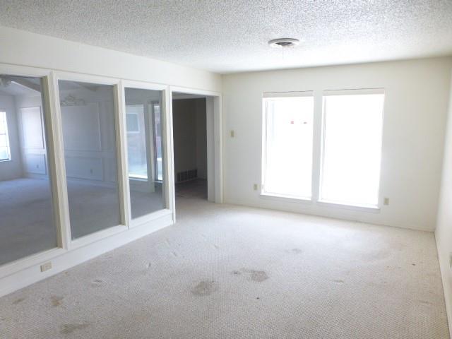 4612 Ranch View Road Fort Worth, TX 76109 - Photo 9 of 17 an empty room with closet and a window