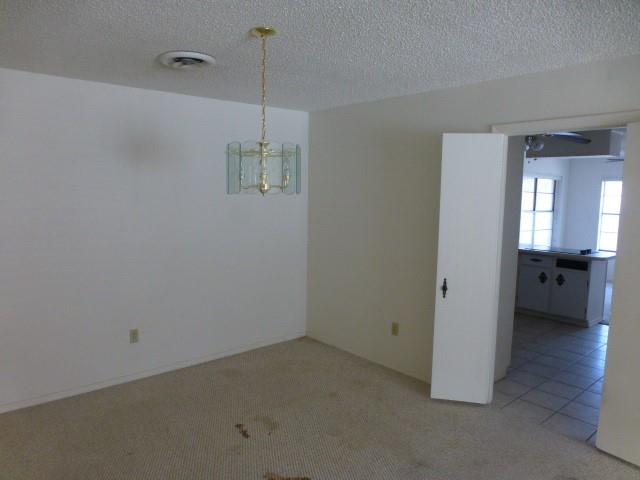 4612 Ranch View Road Fort Worth, TX 76109 - Photo 10 of 17 a view of a room with a stylish ceiling fan and entryway