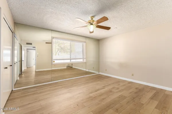 a view of an empty room with a window