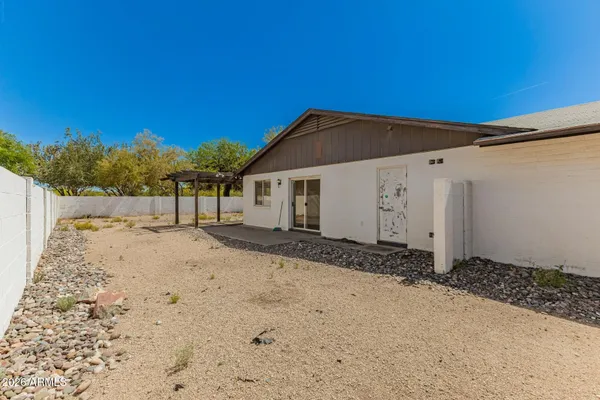 a view of a house with a snow in the background