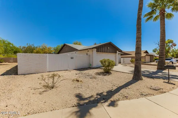 a view of a backyard of the house