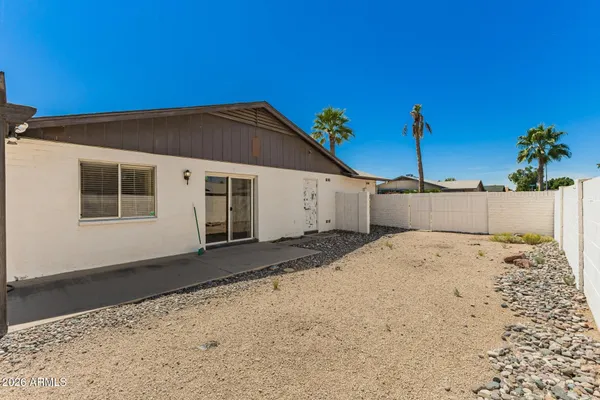 a view of a backyard of the house