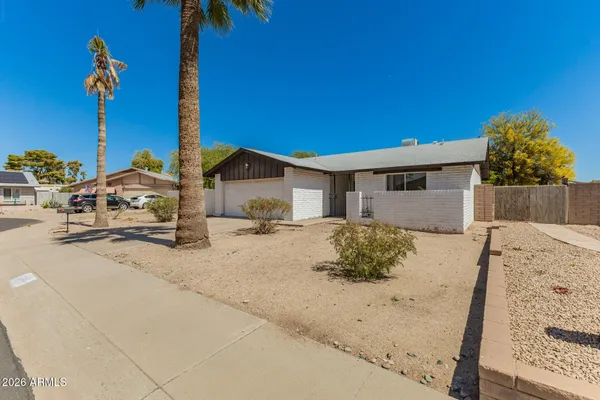 a view of a house with a snow in the yard